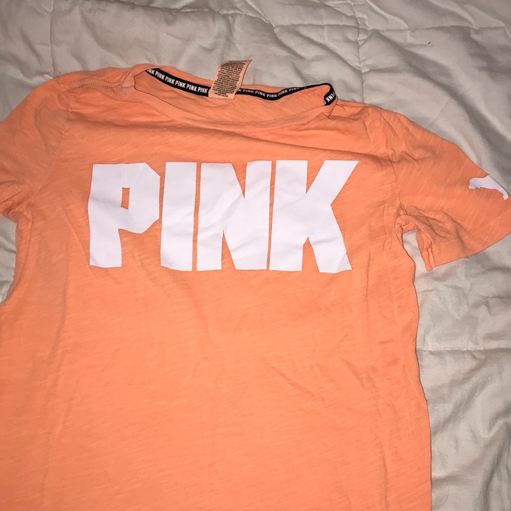 Orange victorious secret t-shirt.